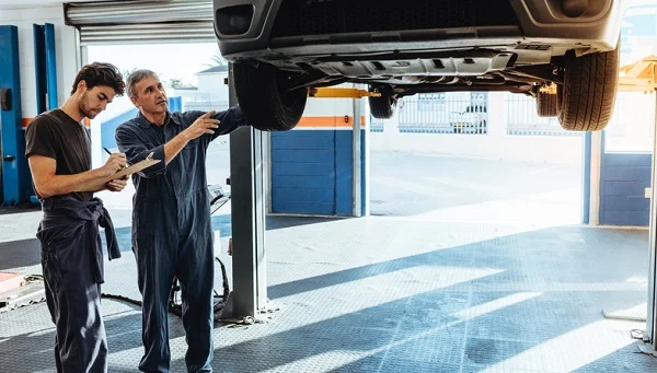 Mechanics Making List Of Car Malfunctions
